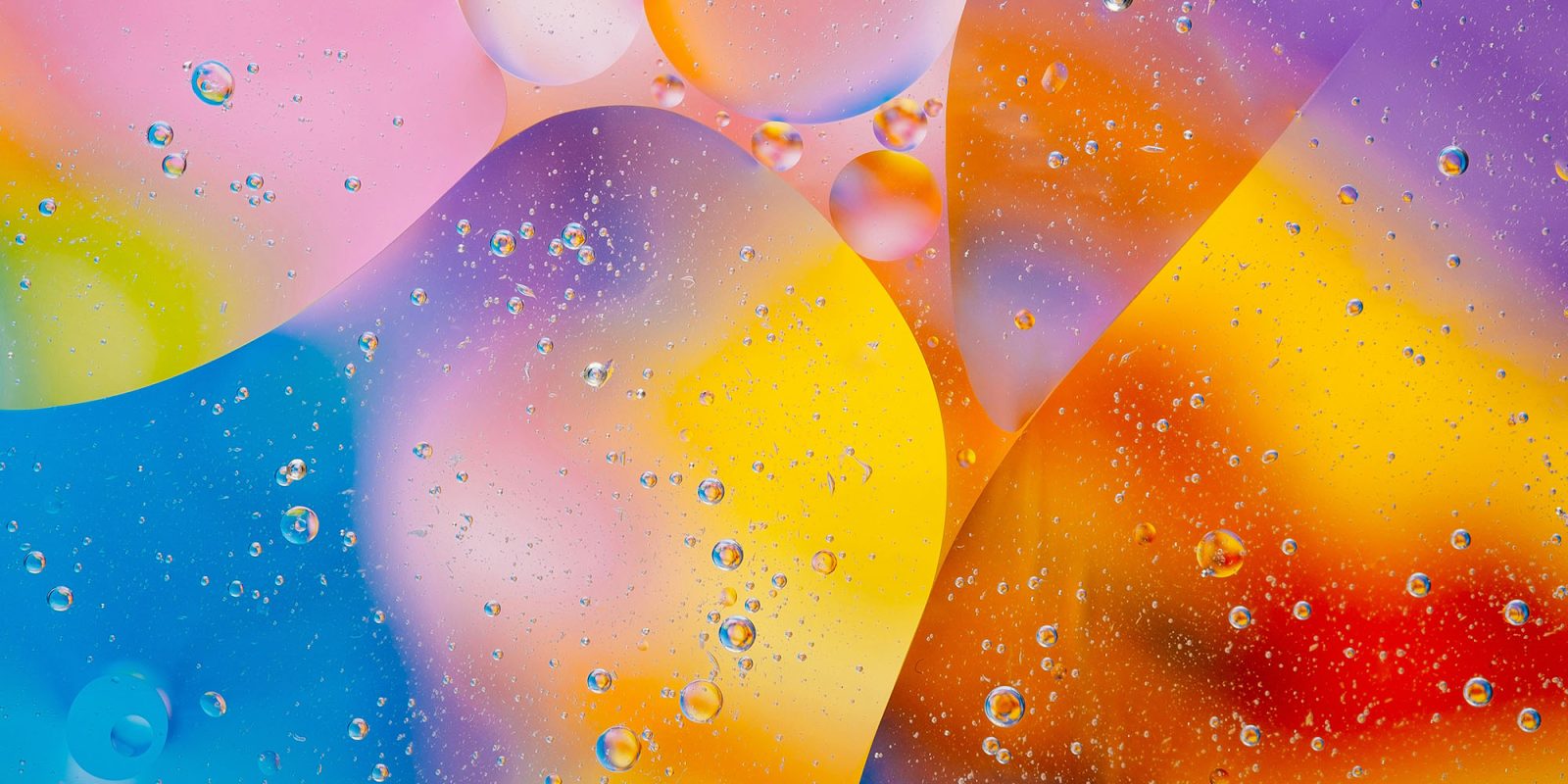 A completely new look for iOS 19 probably matters more than Siri to most people | Abstract image of colorful bubbles